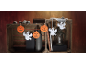 Halloween decorations with pumpkins and ghosts, arranged in a wooden crate.