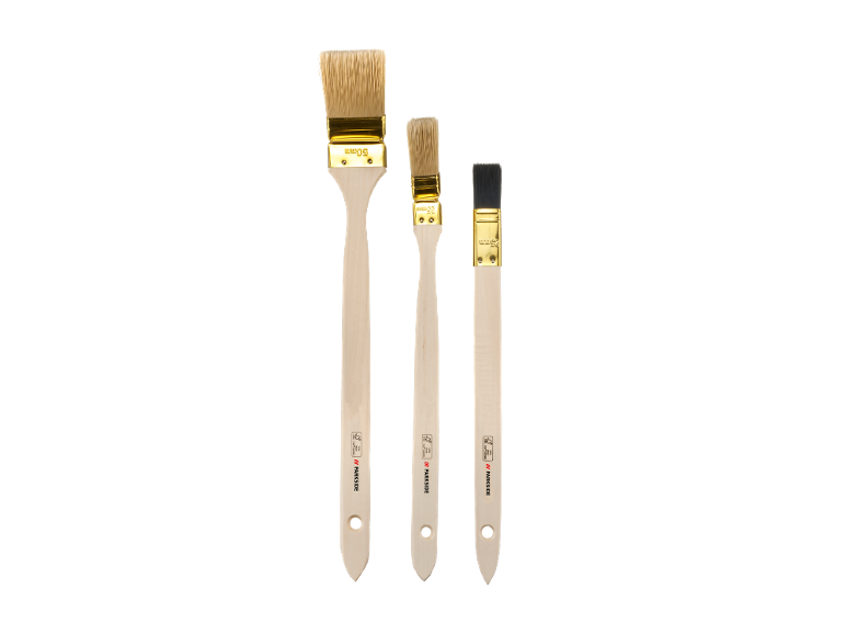 Set of three paint brushes of different sizes with wooden handles and golden ferrules.