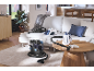 Vacuum cleaners and steam cleaner in a modern living room