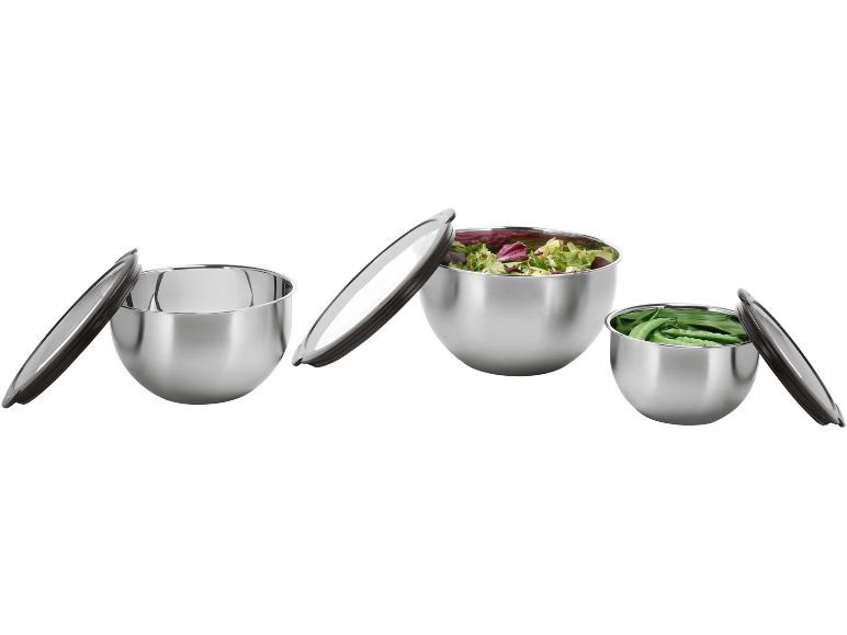 Three stainless steel bowls with lids, two filled with salad and peas.