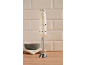 Cream hand blender with '1973' inscription on a wooden countertop with a bowl.