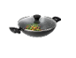 Non-stick wok with a glass lid, filled with vegetables