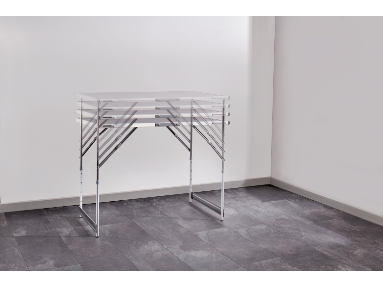 Aluminum folding table with adjustable legs in an empty room.