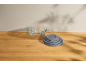 Set of glass storage bowls with gray lids on a wooden table.