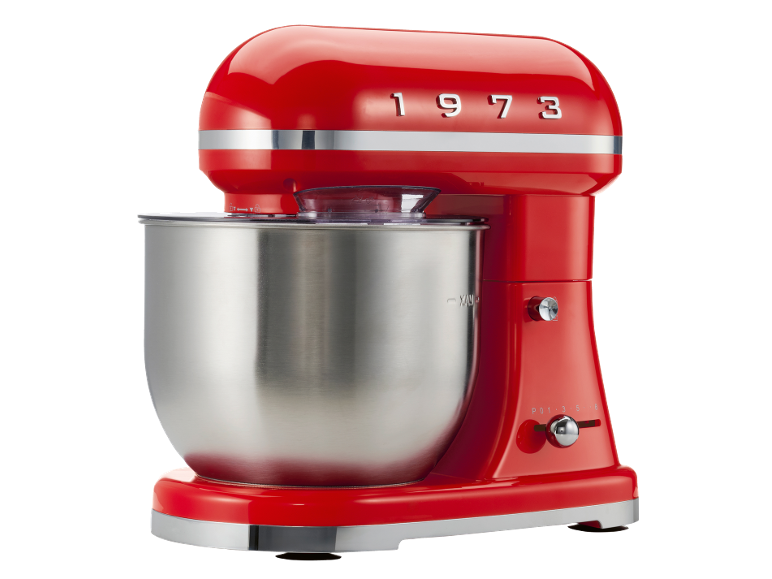 Red stand mixer with a stainless steel bowl and '1973' embossed on top.