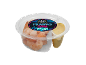 Cooked prawns with jerk dip in a plastic container, Latin American style.
