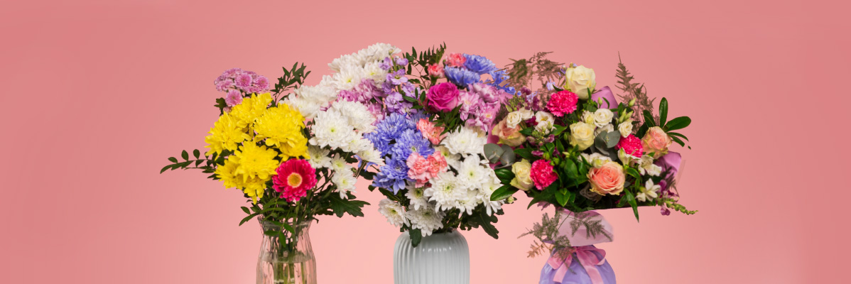 Three vibrant bouquets featuring yellow, white, pink, and blue flowers on a pink background.