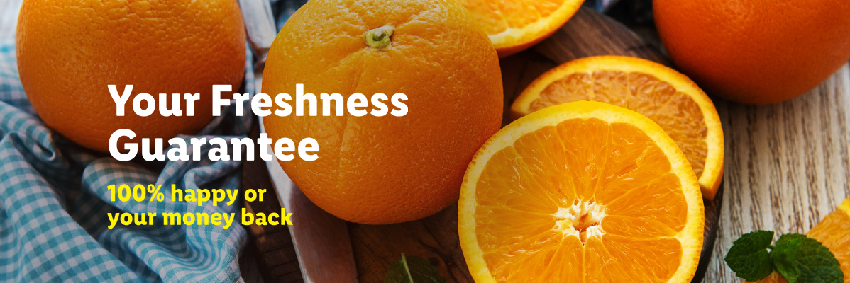 Fresh oranges, whole and sliced, with text: Your Freshness Guarantee, 100% happy or your money back.