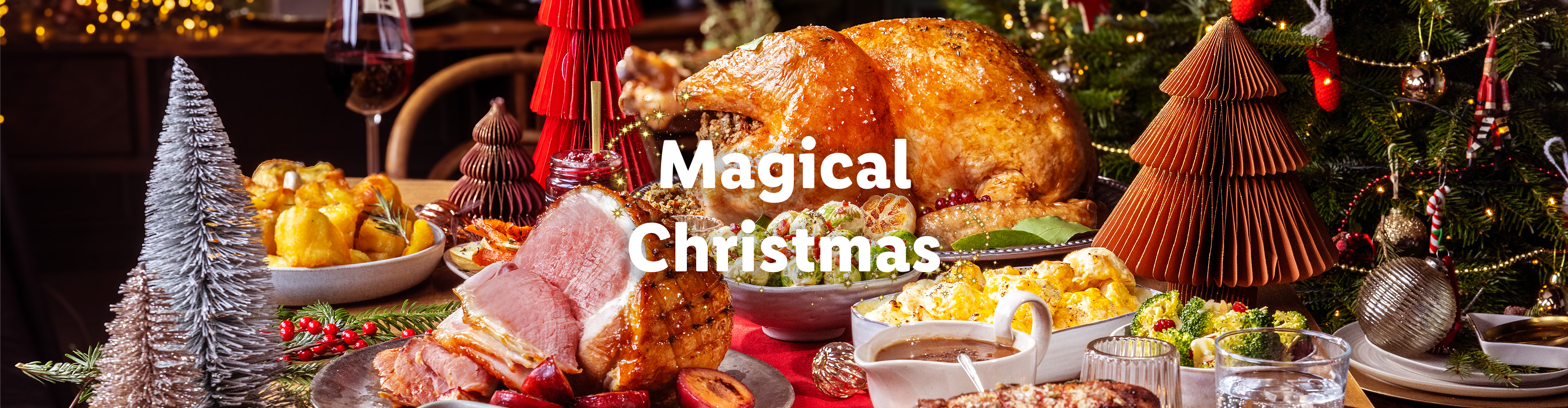 Christmas dinner featuring turkey, ham, and side dishes.