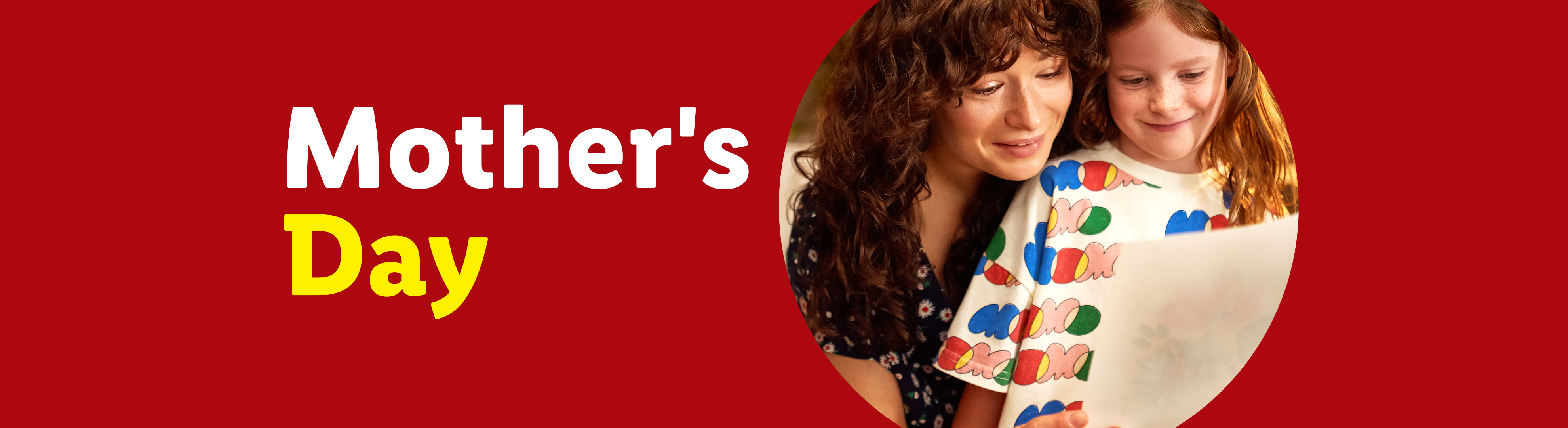 Mother's Day banner with a mother and daughter looking at a drawing.