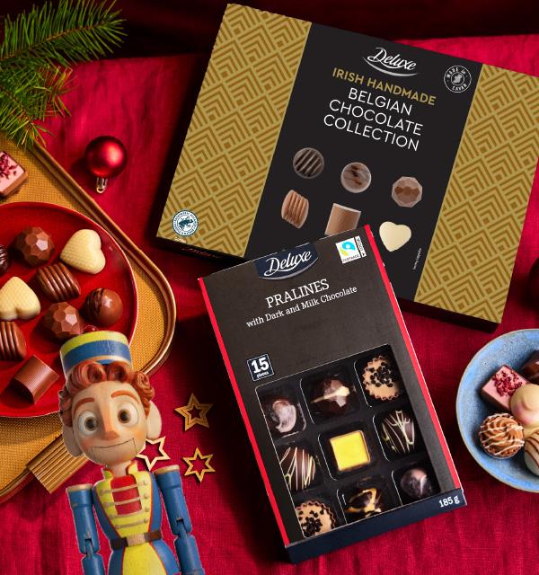 Festive selection of Belgian chocolate and praline gift boxes with a toy soldier.
