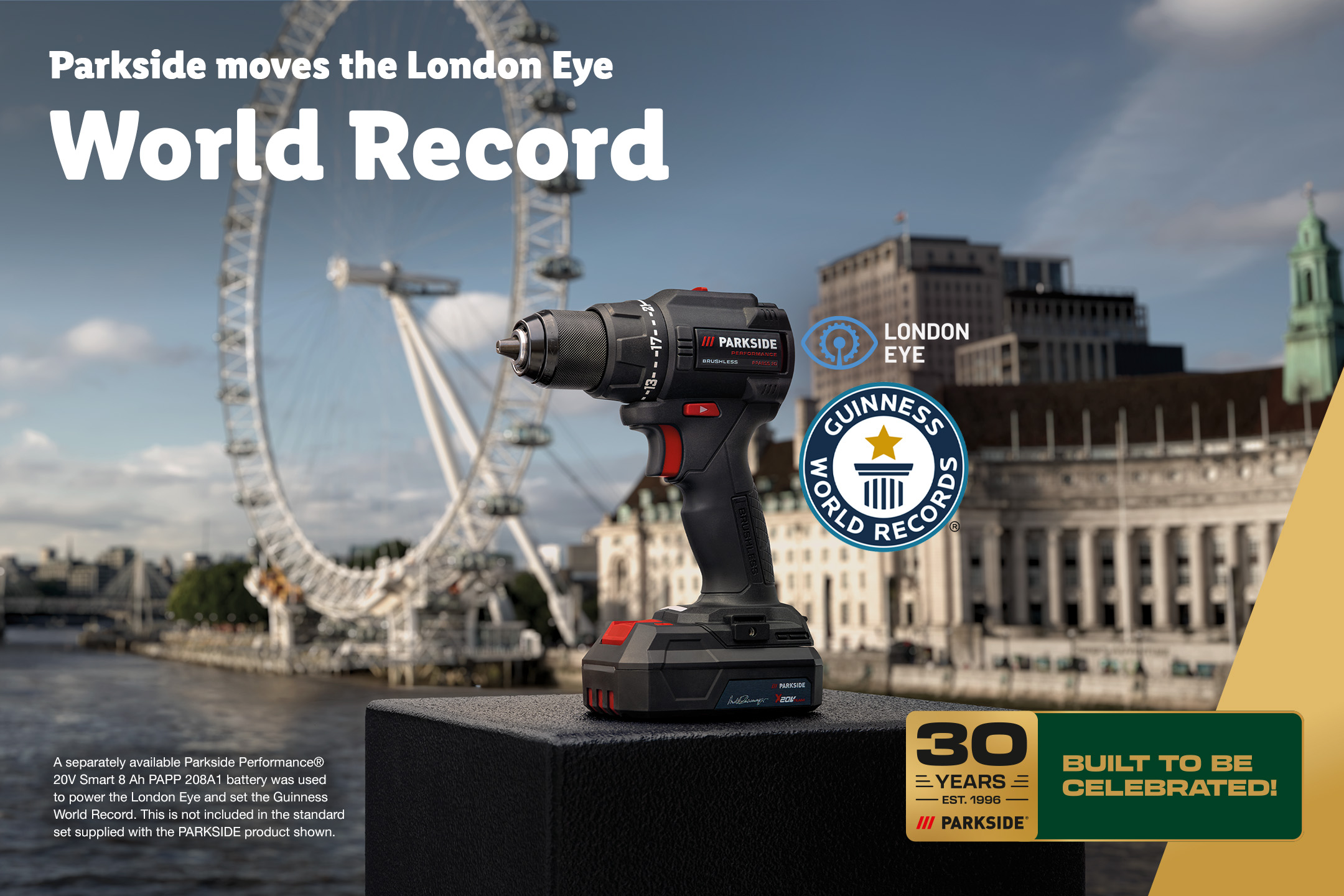 A power drill with a battery pack, set against the London Eye, celebrating a world record.