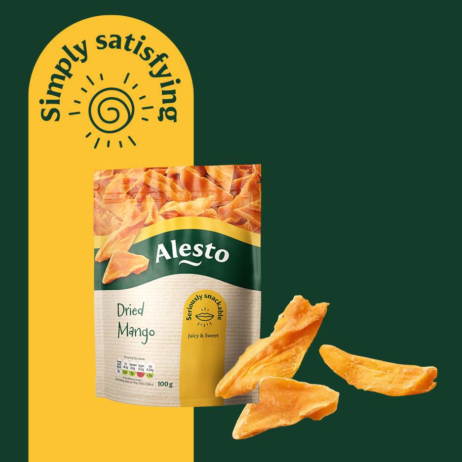 Dried mango snack bag with loose pieces, on a yellow and green background with text 'Simply satisfying'.