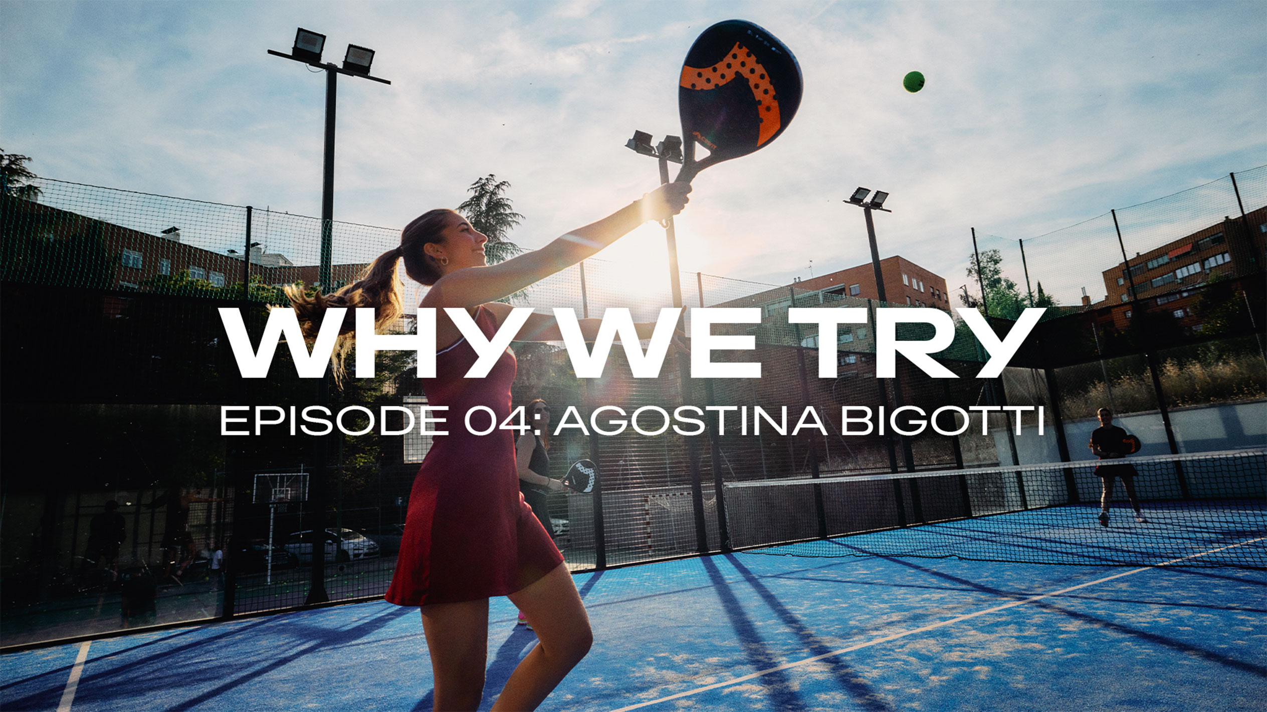 Agostina Bigotti hits a padel ball into the air on an outdoor court with a CRIVIT padel racket.