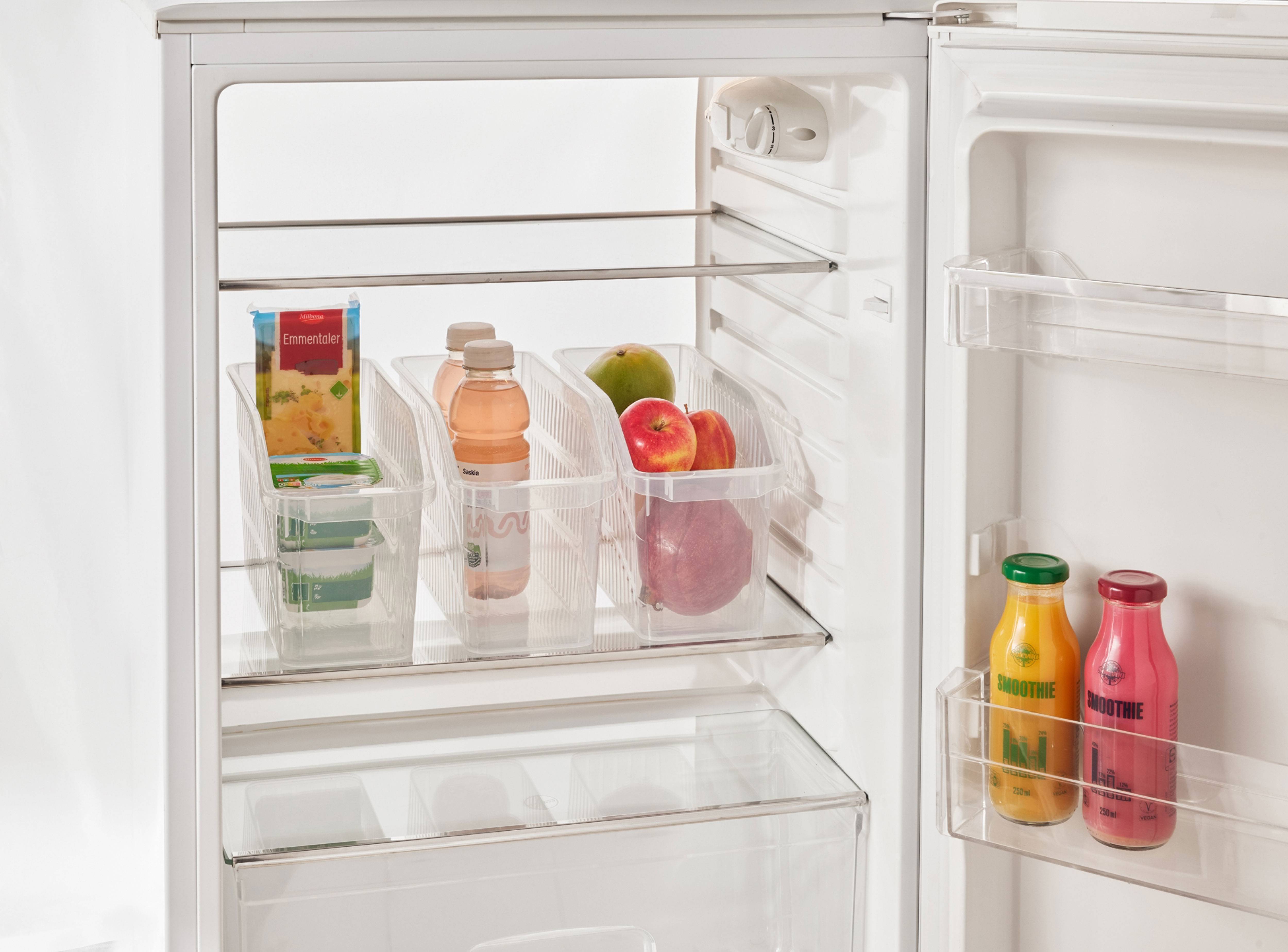 Refrigerator interior with cheeses, drinks, and fruits in clear containers.