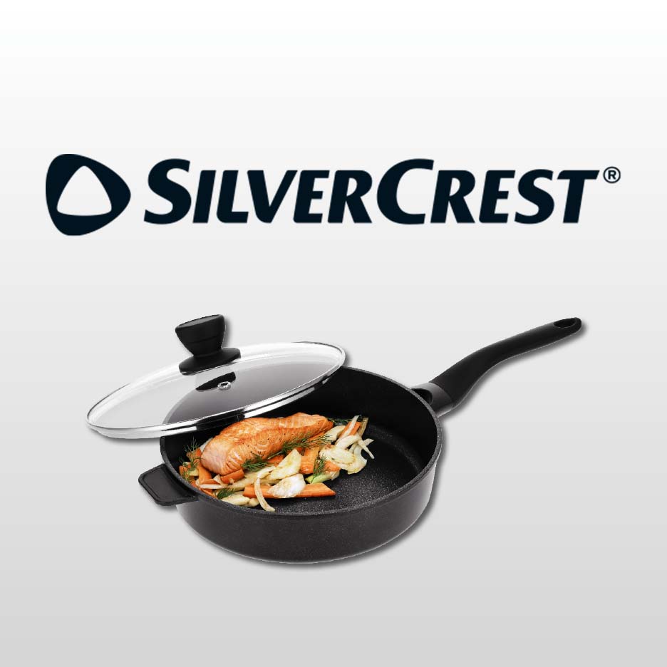 Frying pan with a glass lid, containing salmon and vegetables, on a light grey background.