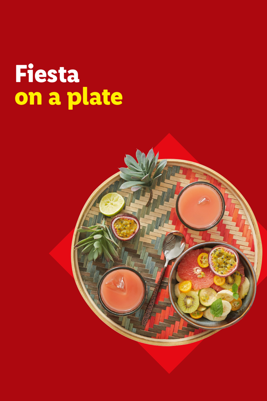 Tropical fruit salad and drinks on a woven tray with text: Fiesta on a plate.
