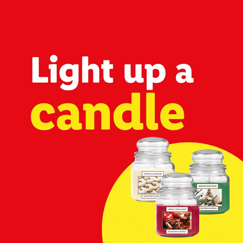 Three scented candles (Vanilla & Sugar, Apple Cinnamon, Birchwood Pine) on a red background.