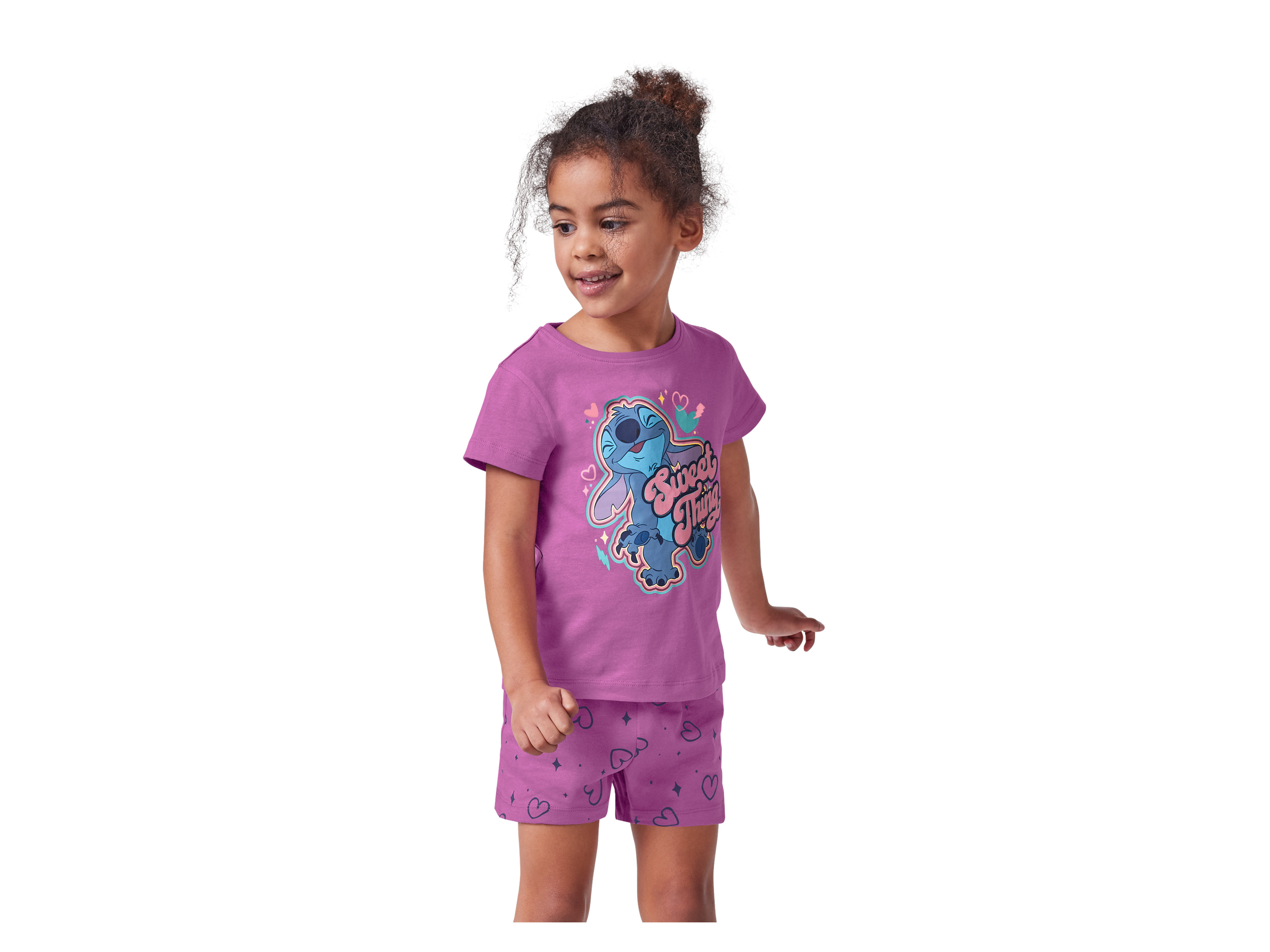 A young girl models a purple Stitch-themed pajama set featuring a short-sleeved shirt and shorts.