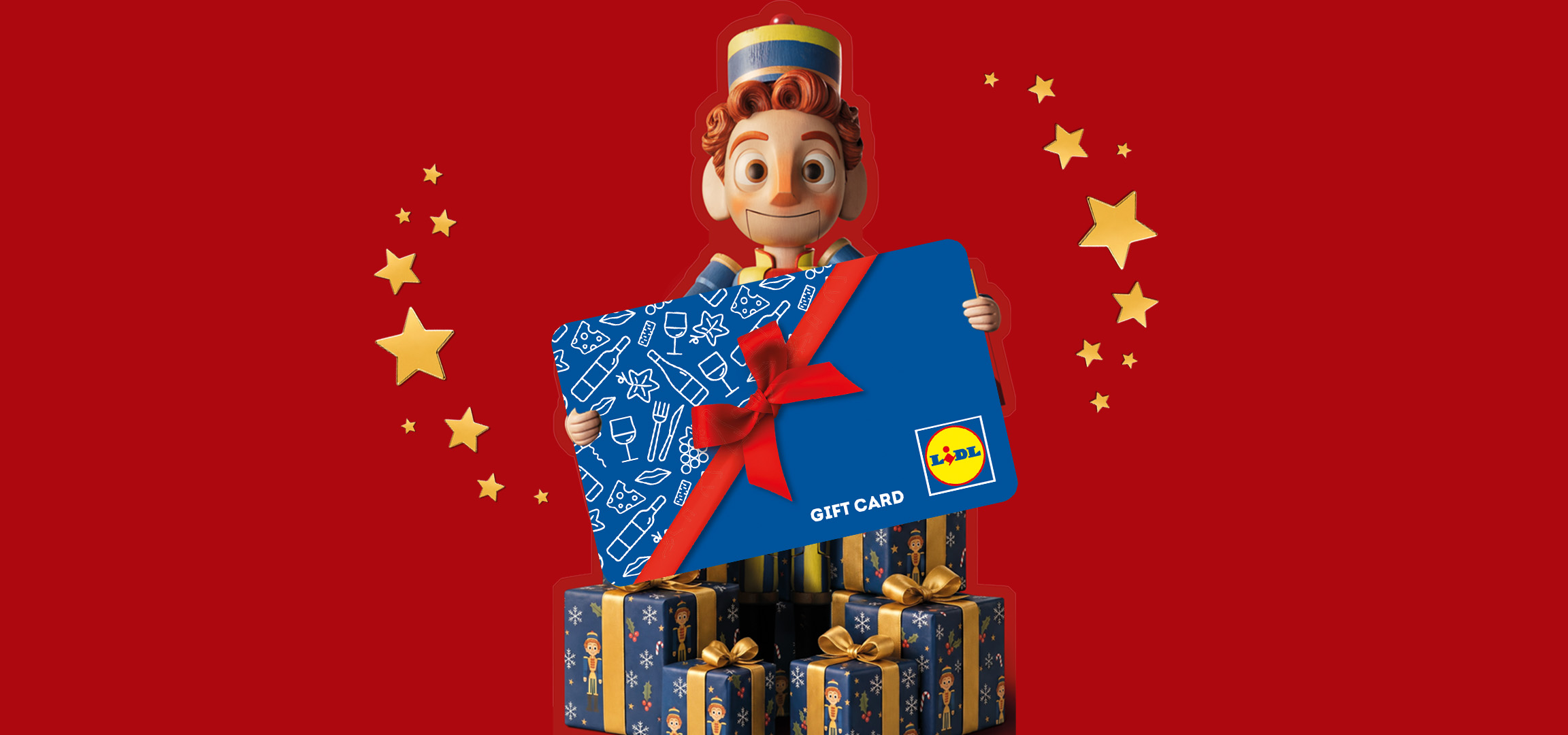 Lidl Gift Card held by a toy soldier character against a red background with stars and gift boxes.
